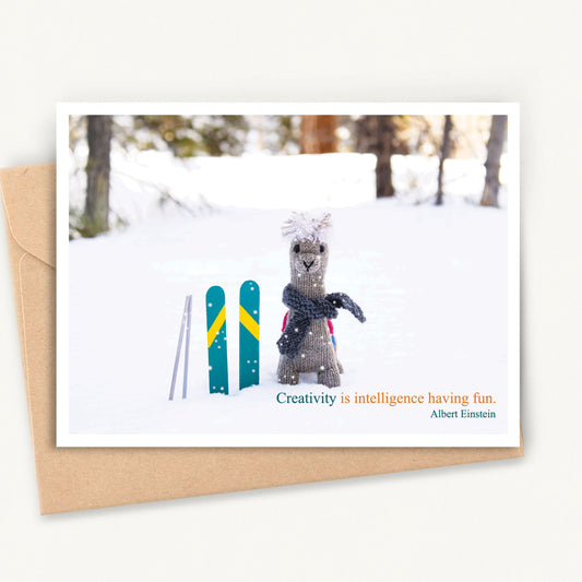 Greeting Card with Knitted Alpaca in the Snow, Quote by Einstein